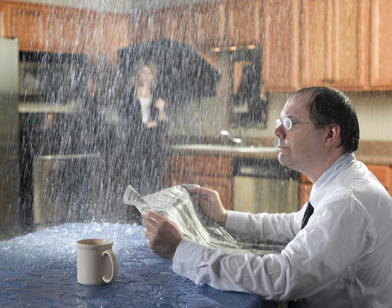 Man with serious plumbing leak in kitchen